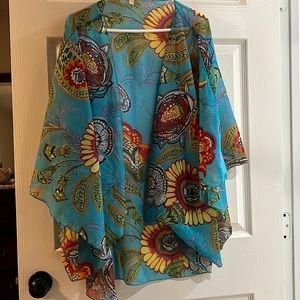 Almost new, open tunic